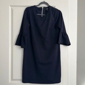 Navy knee length dress with peplum sleeves